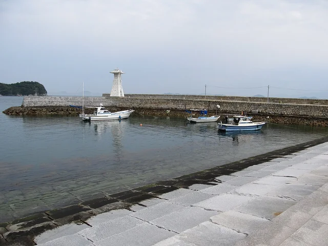 Mitarai port view showing the historic lighthouse and harbor district.