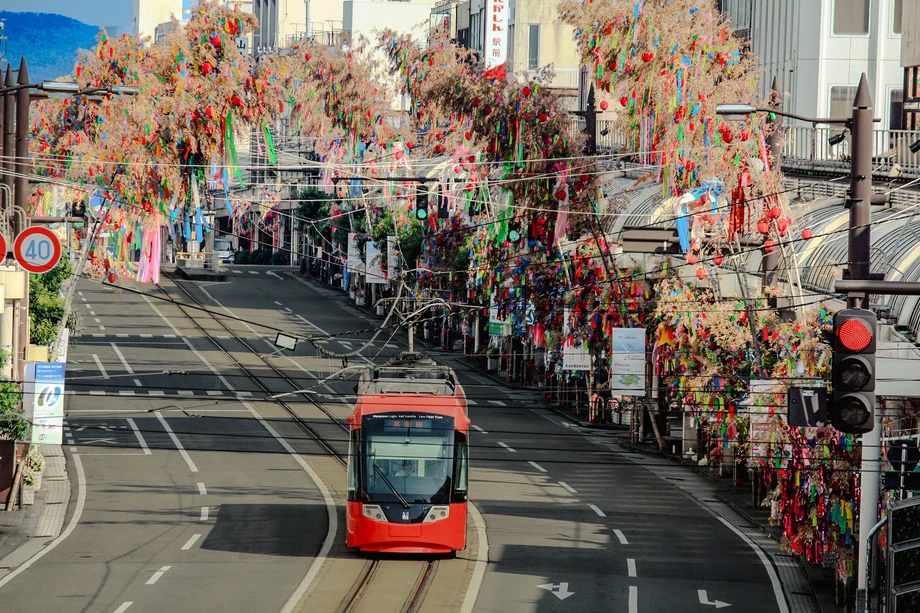Manyosen tram running through the streets decorated for Takaoka Tanabata Festival